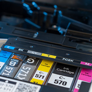 inner parts of a printer, showing the color cartridges